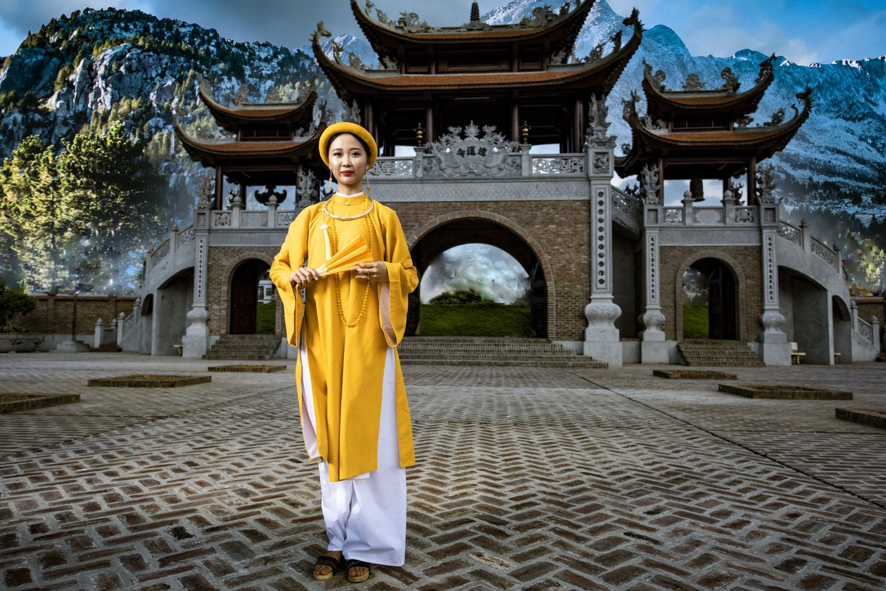 Woman infront of a Vietnamese Temple